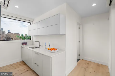 a balcony view with a seating space