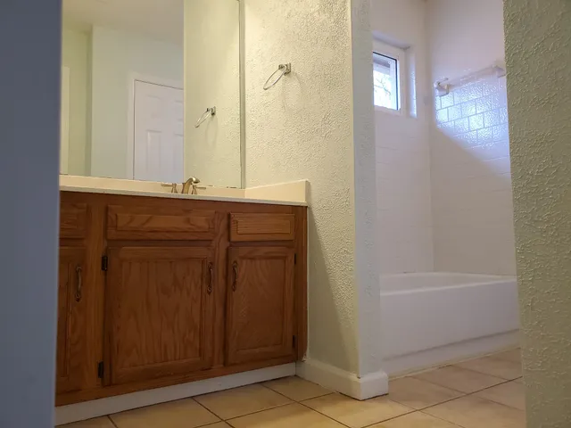 a bathroom with a bathtub and a sink