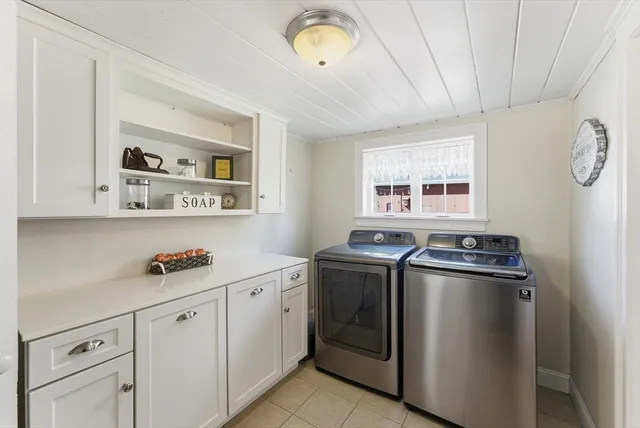 a kitchen with cabinets and window