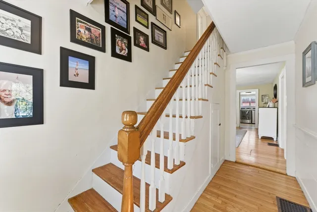 a view of an entryway with wooden floor