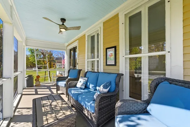 a living room with furniture and a window