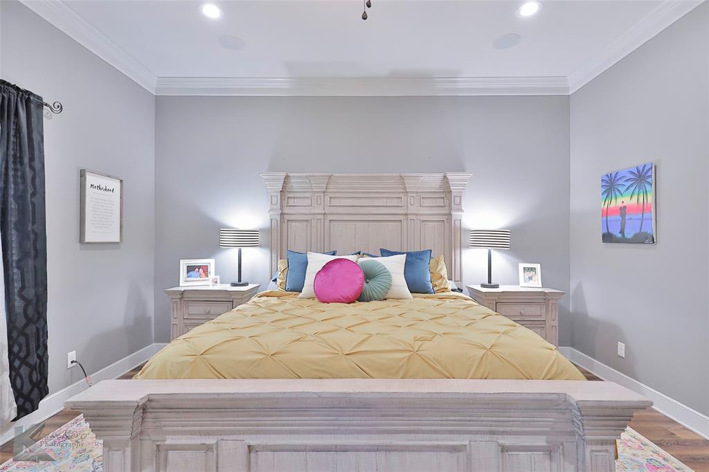 125 Wallace Court Tuscola, TX 79562 - Photo 17 of 40 a bedroom with a bed and a painting on the wall