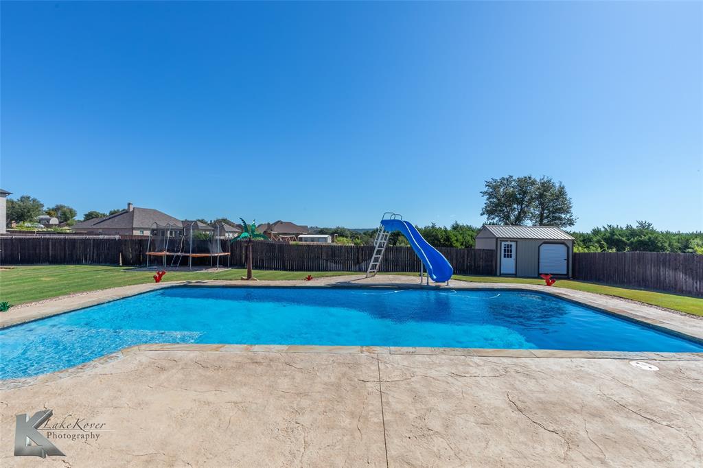125 Wallace Court Tuscola, TX 79562 - Photo 36 of 40 a view of a swimming pool with lounge chair