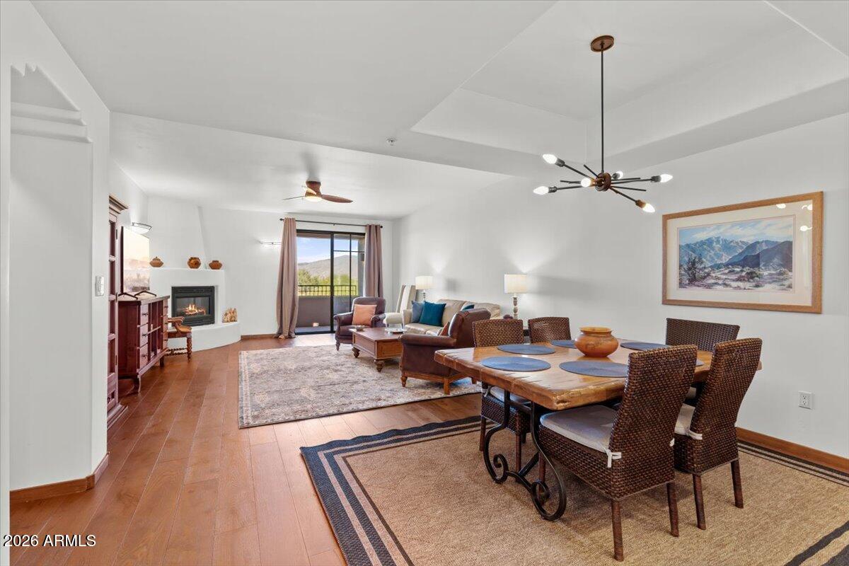 36601 North Mule Train Road, Unit C16 Carefree, AZ 85377 - Photo 16 of 35 a living room with furniture and a chandelier