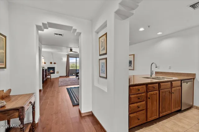 a spacious bathroom with a double vanity sink and a mirror