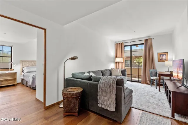 a living room with furniture and a large window