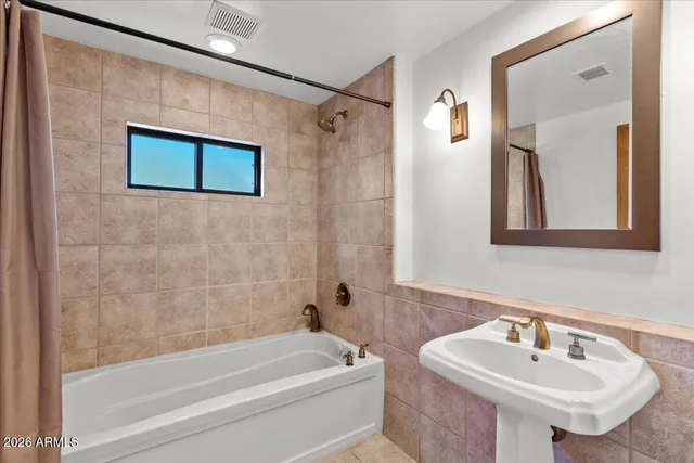 a bathroom with a sink and a bathtub