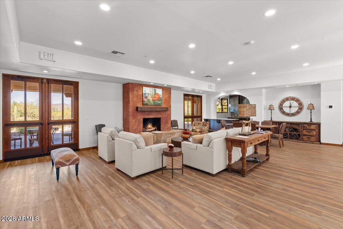 36601 North Mule Train Road, Unit C16 Carefree, AZ 85377 - Photo 29 of 35 a living room with furniture and a wooden floor