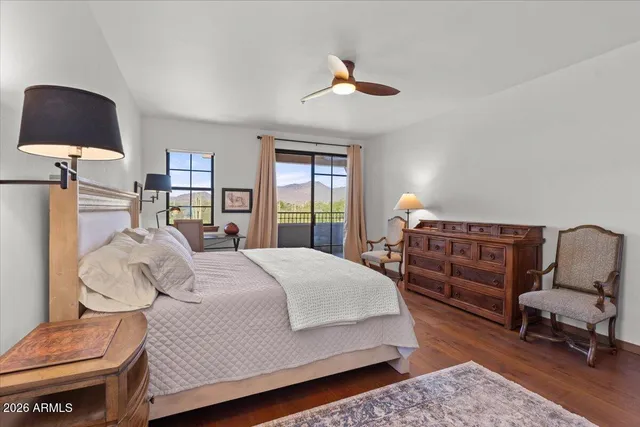 a bed room with a bed and a chair