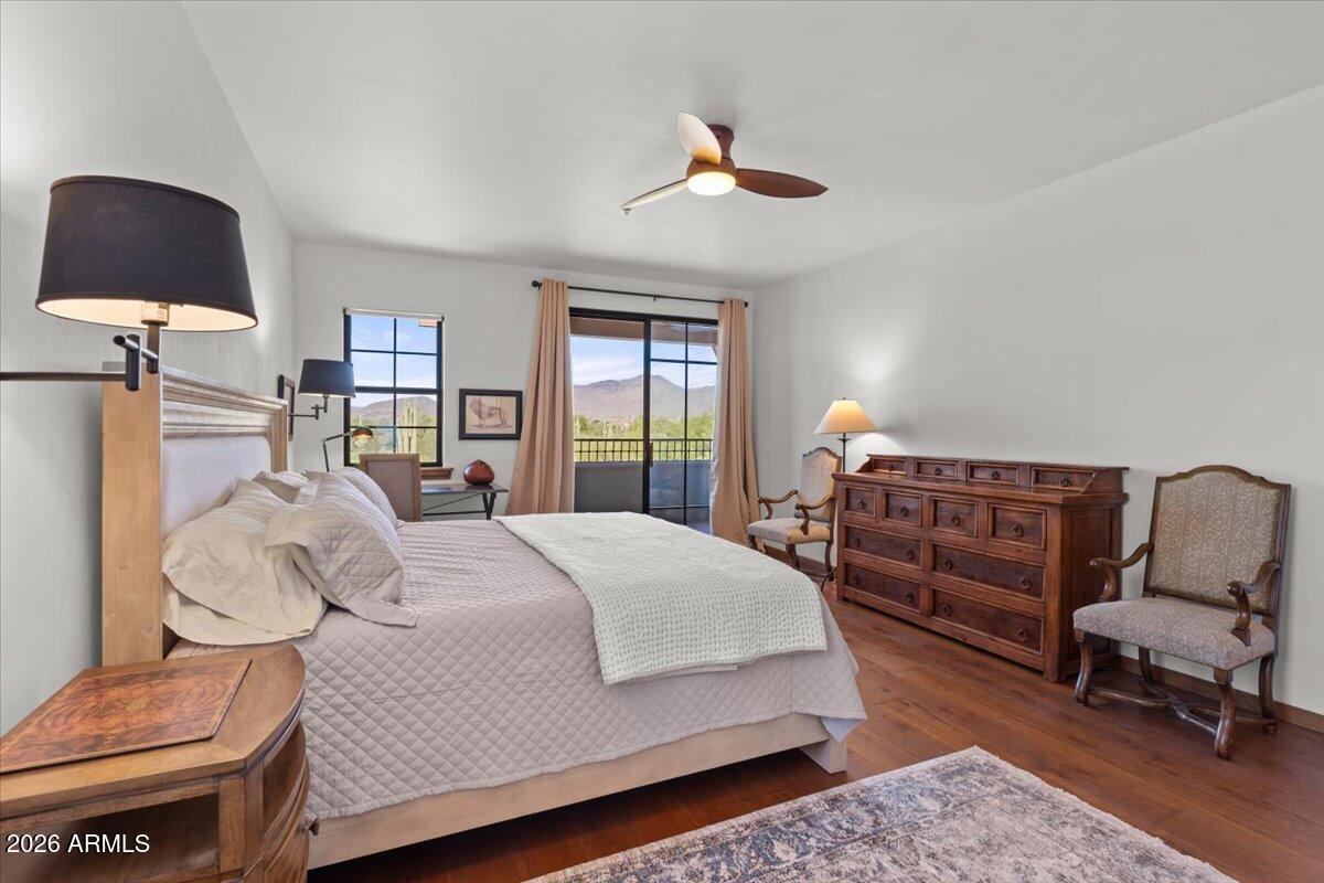 36601 North Mule Train Road, Unit C16 Carefree, AZ 85377 - Photo 9 of 35 a bed room with a bed and a chair