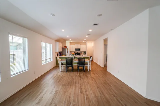 a kitchen with a table and chairs