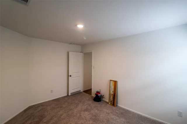 an empty room with air conditioner and closet