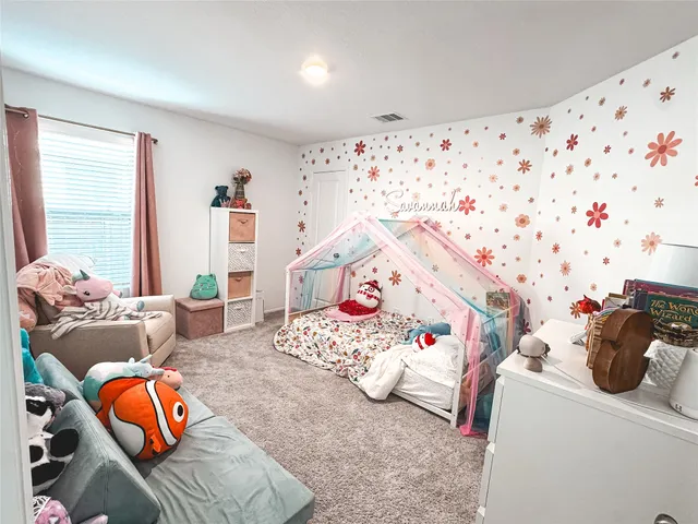 a bedroom with furniture and a bed