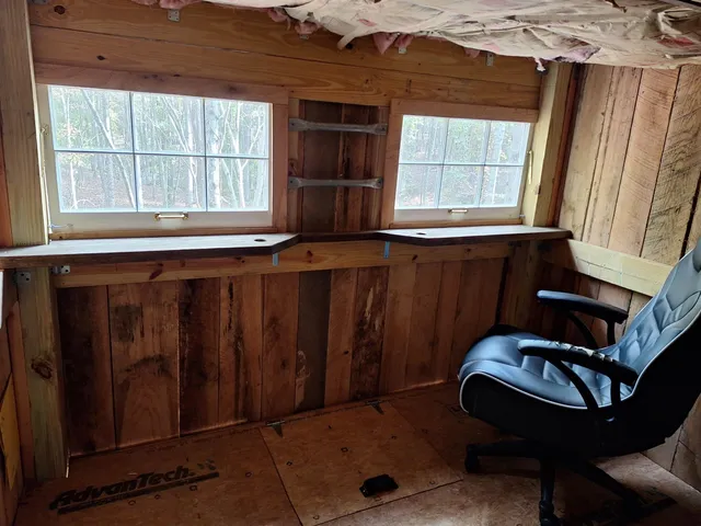 a living room with furniture and windows