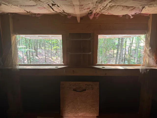 a view of an empty room with a door