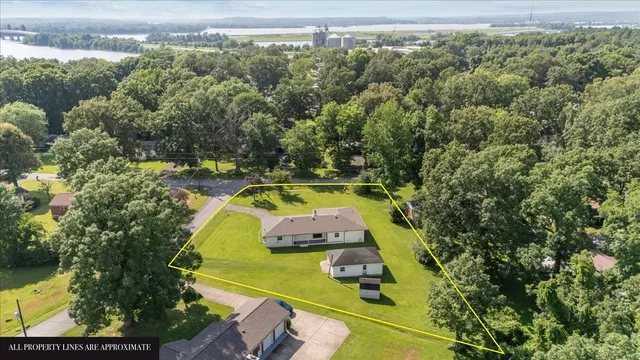 an aerial view of a house with swimming pool