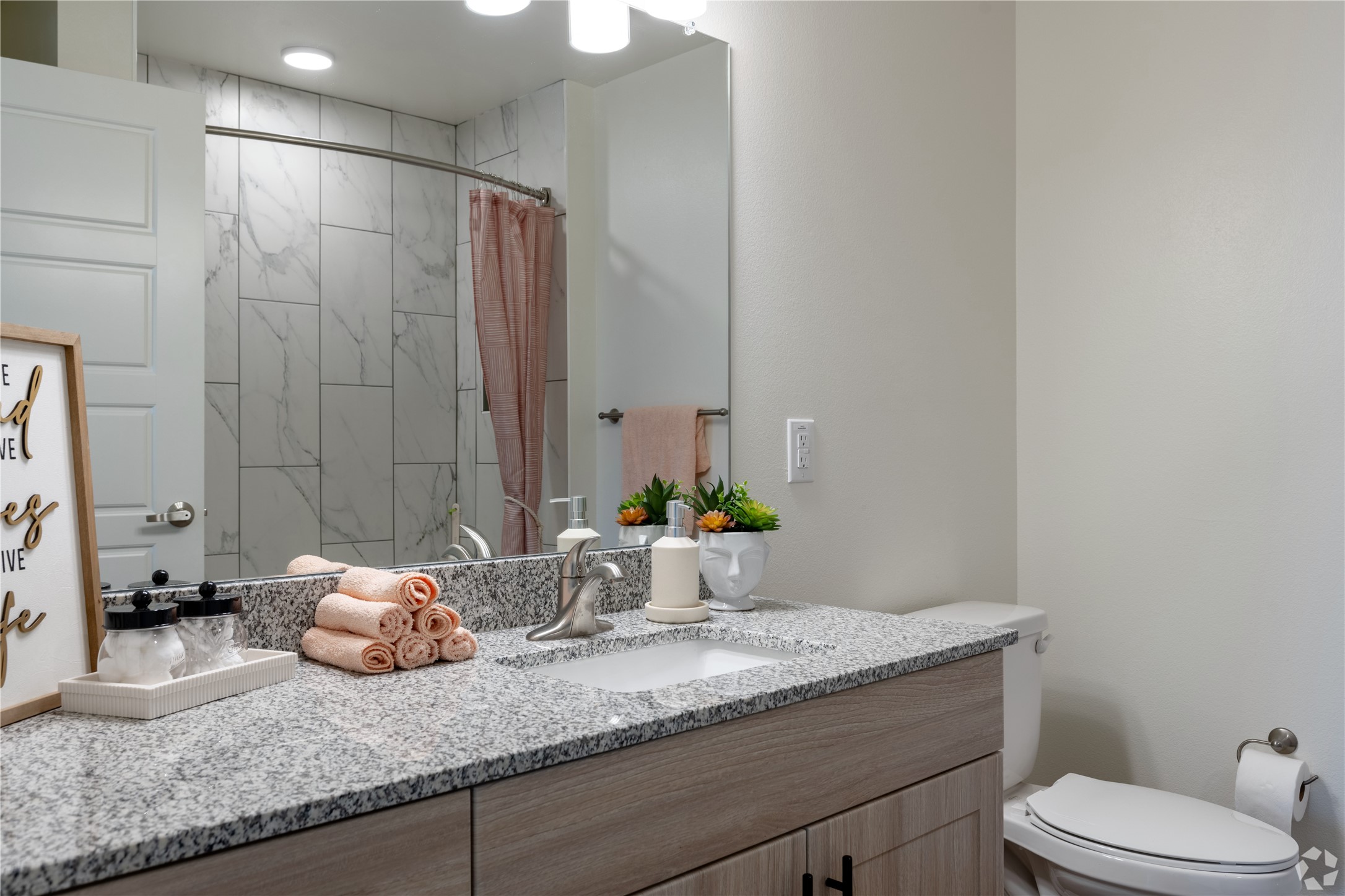 1200 West Koenig Lane Austin, TX 78756 - Photo 19 of 22 a bathroom with a granite countertop sink and a mirror