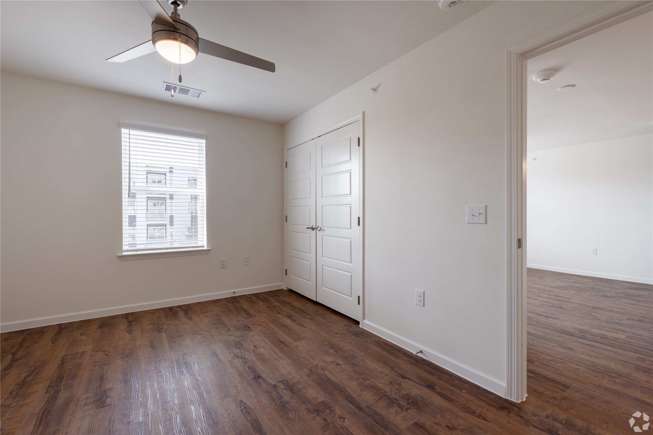 1200 West Koenig Lane Austin, TX 78756 - Photo 20 of 22 wooden floor in an empty room with a window