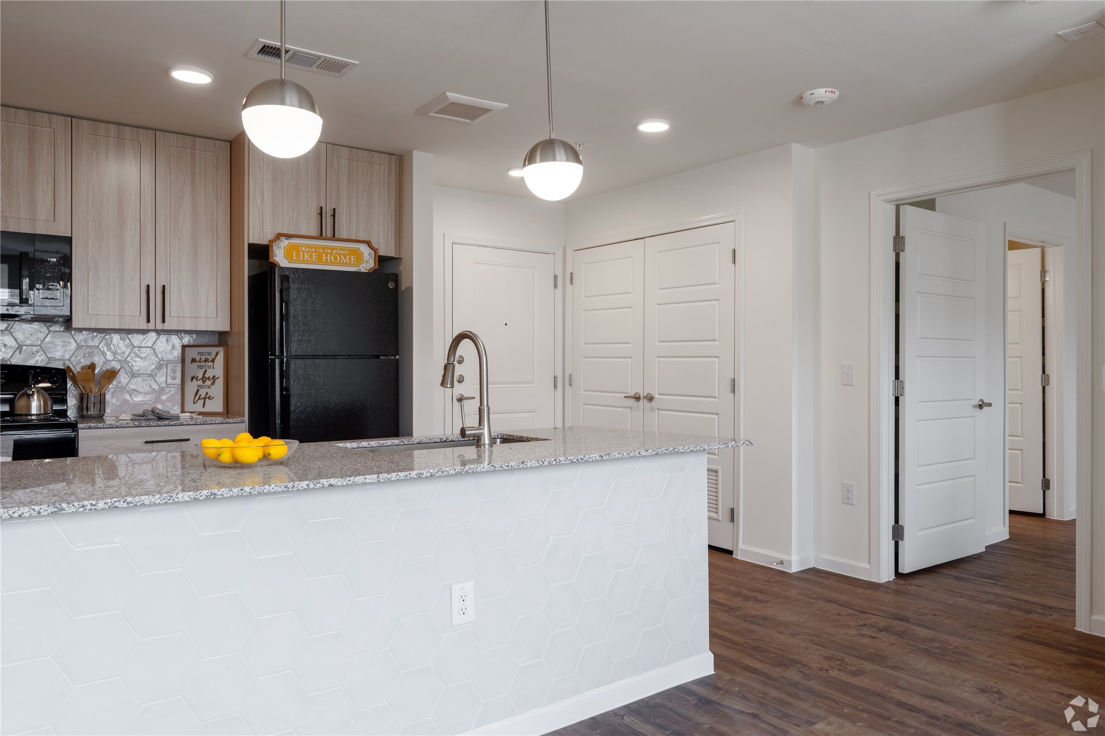 1200 West Koenig Lane Austin, TX 78756 - Photo 21 of 22 a kitchen with stainless steel appliances granite countertop a sink a refrigerator and a stove