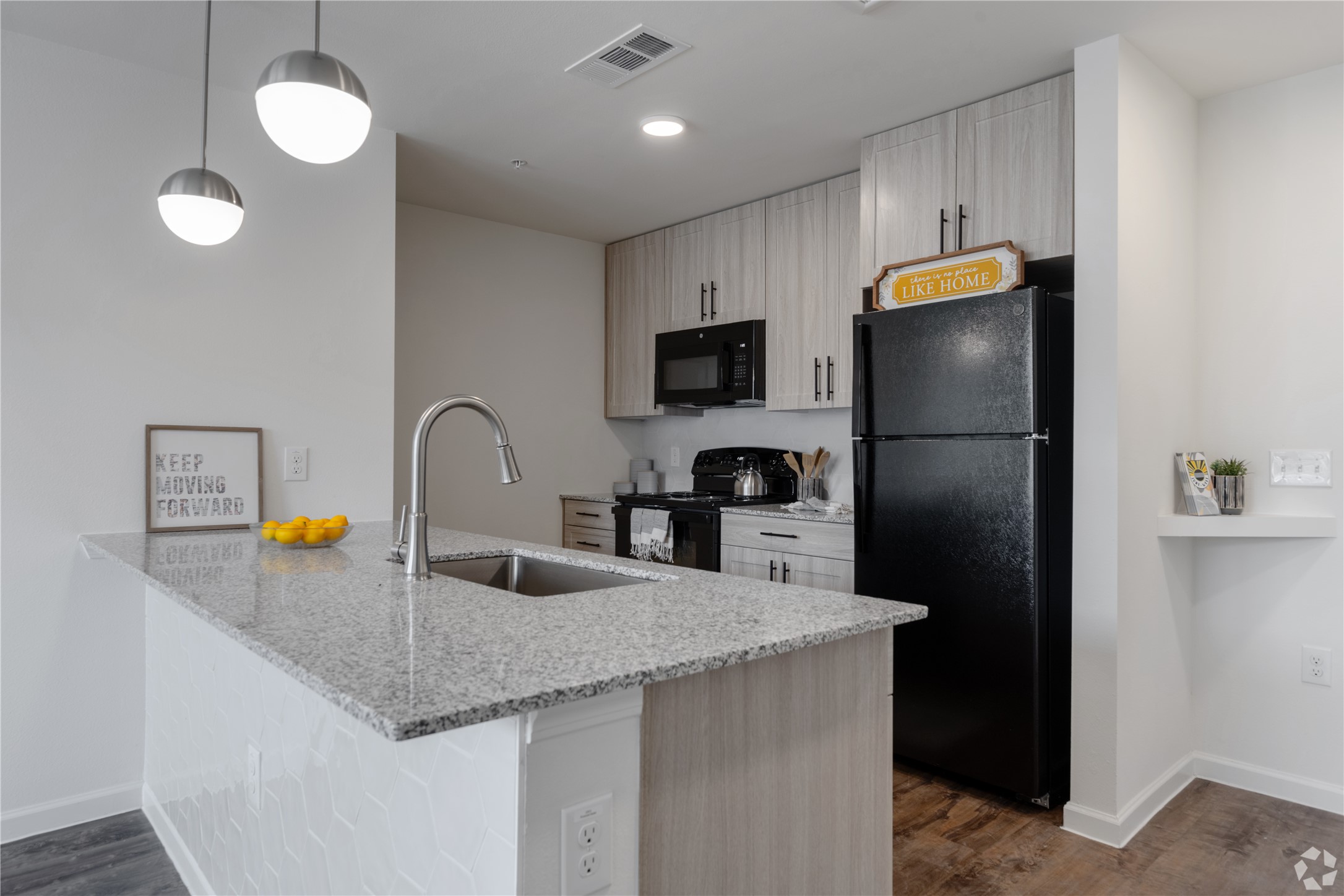 1200 West Koenig Lane Austin, TX 78756 - Photo 22 of 22 a kitchen with refrigerator and microwave