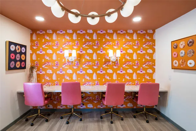 a view of a room with furniture and wooden floor