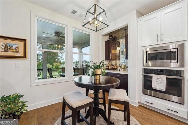 103 Rabun Court Hoschton, GA 30548 - Photo 9 of 22 a dining room with furniture and window