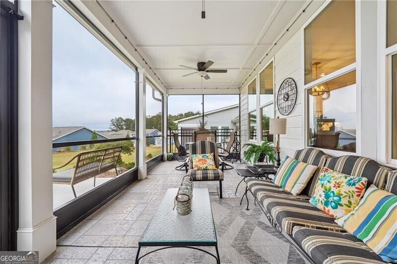 103 Rabun Court Hoschton, GA 30548 - Photo 17 of 22 a living room with furniture and a large window