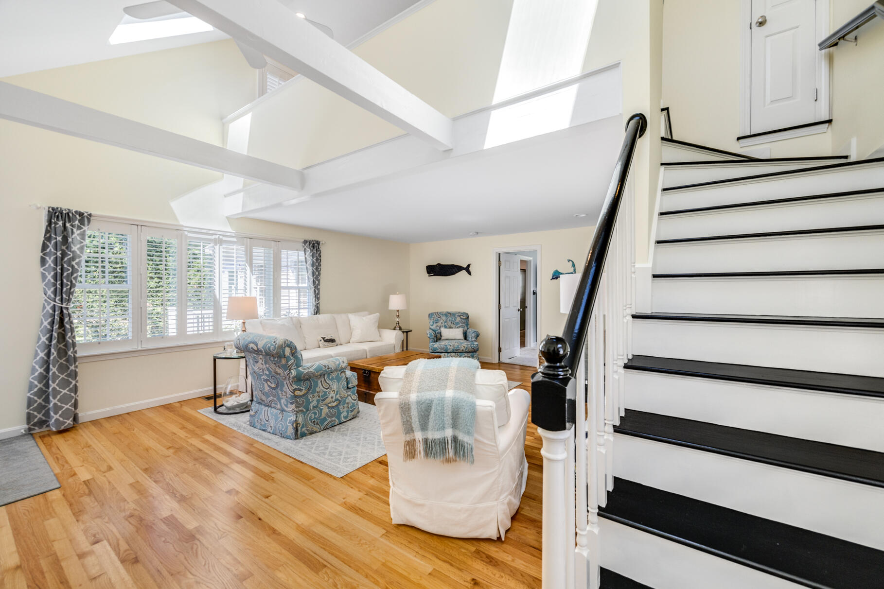 8 Beach Road, Unit 4 Orleans, MA 02653 - Photo 14 of 51 a living room with furniture and a wooden floor
