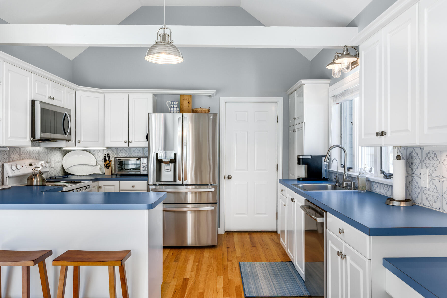 8 Beach Road, Unit 4 Orleans, MA 02653 - Photo 5 of 51 a kitchen with granite countertop a refrigerator stove top oven and sink