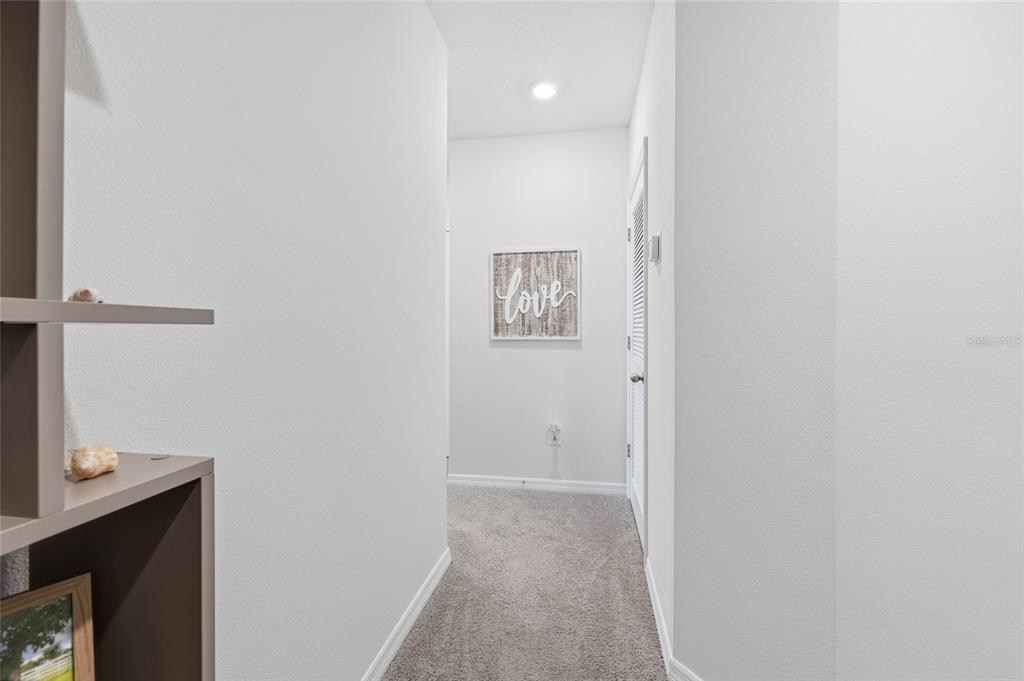 32992 Major Oak Drive Wesley Chapel, FL 33545 - Photo 19 of 56 a view of a hallway with workspace