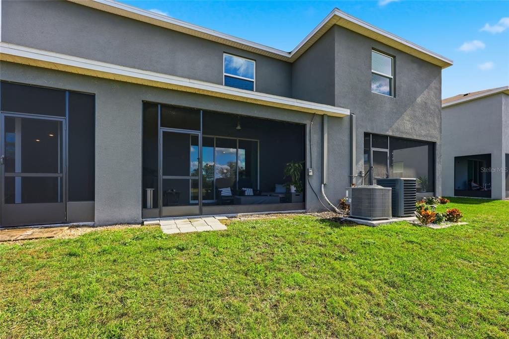 32992 Major Oak Drive Wesley Chapel, FL 33545 - Photo 30 of 56 a view of a house with a yard and sitting area
