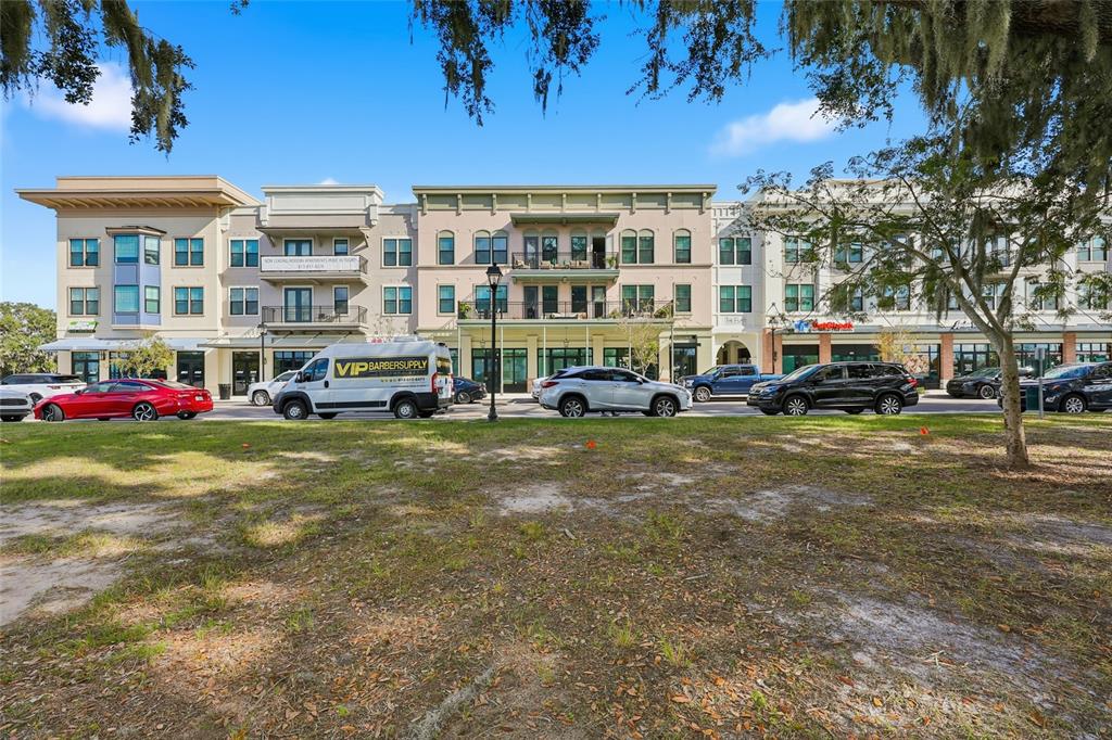 32992 Major Oak Drive Wesley Chapel, FL 33545 - Photo 56 of 56 a cars parked in front of a building