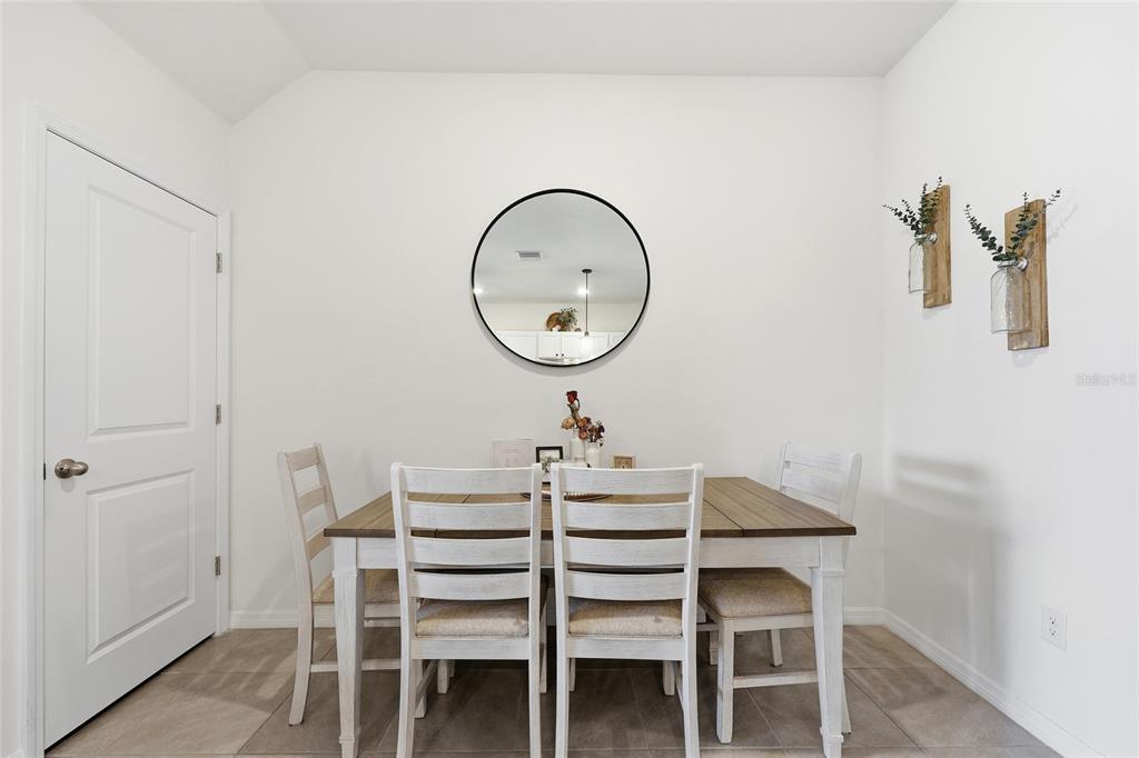 32992 Major Oak Drive Wesley Chapel, FL 33545 - Photo 9 of 56 a view of a dining room with furniture