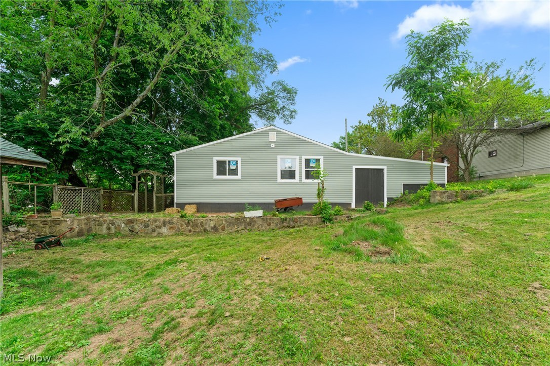 3568 McCartney Road Youngstown, OH 44505 - Photo 26 of 29 Rear view of property featuring a yard