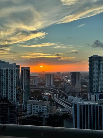 a kitchen with stainless steel appliances granite countertop a sink and a stove top oven