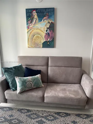 a bedroom with a bed and a lamp