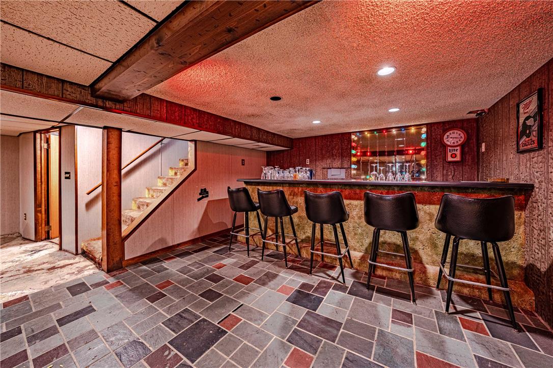 4352 Ruth Road Emmaus, PA 18049 - Photo 15 of 33 A vibrant entertainment zone featuring a fully equipped bar and eclectic flooring.