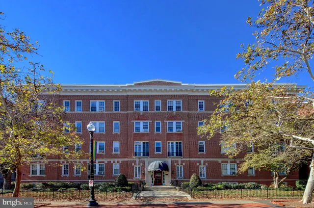 a front view of a building with street view