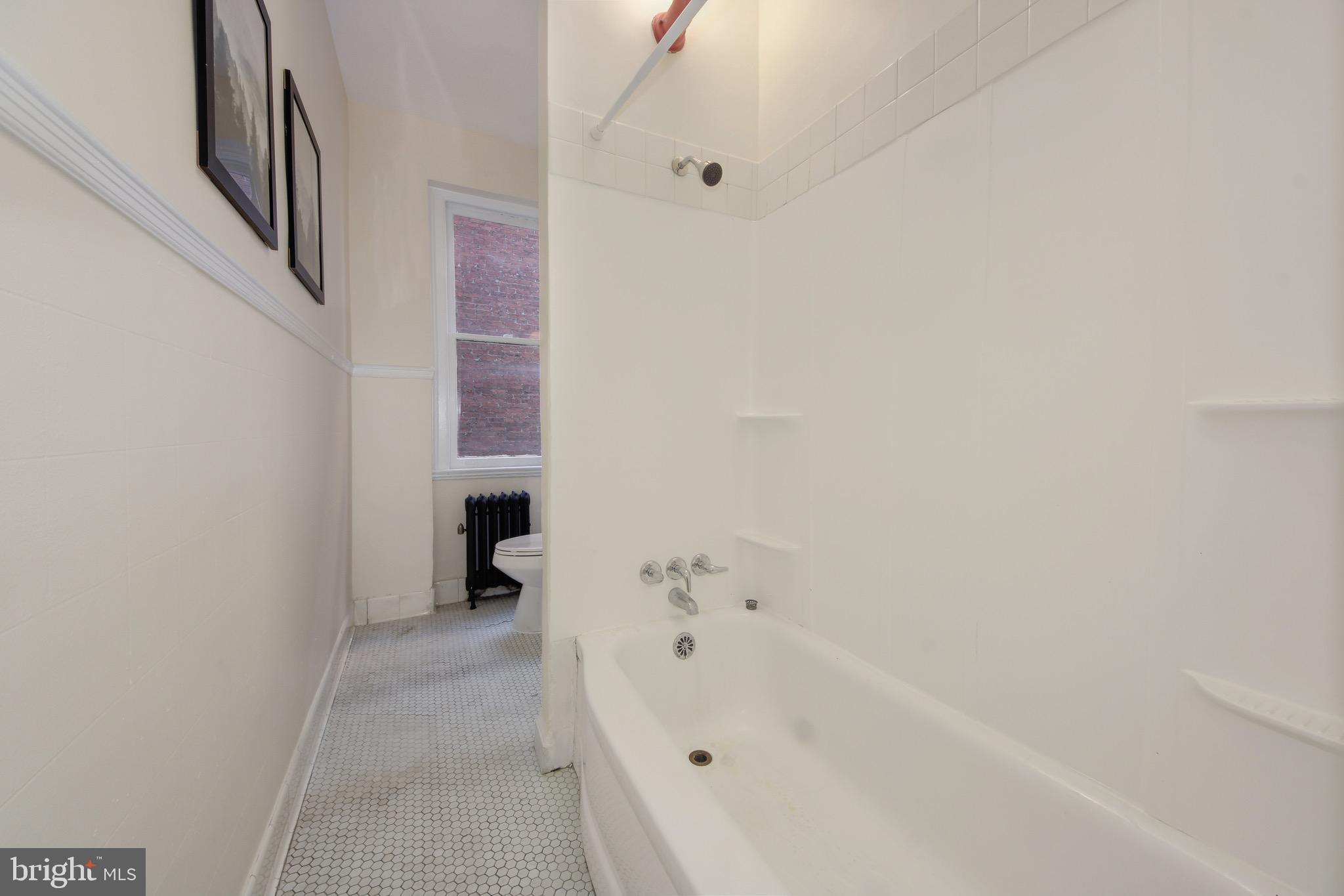 1526 17th Street Northwest, Unit 207 Washington, DC 20036 - Photo 13 of 49 a bathroom with a bathtub and a shower
