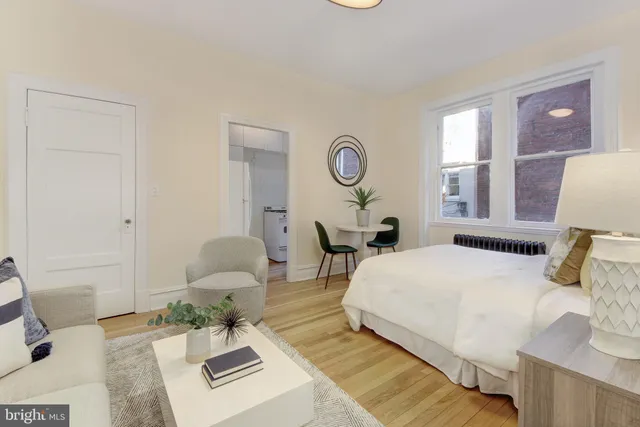 a bed room with a bed furniture and a window