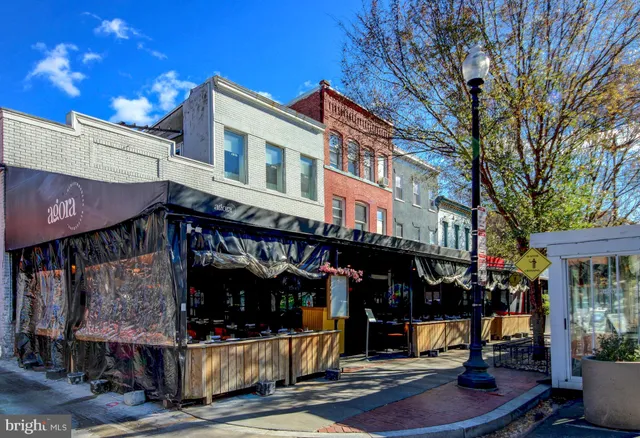 a view of a chairs and tables in the patio