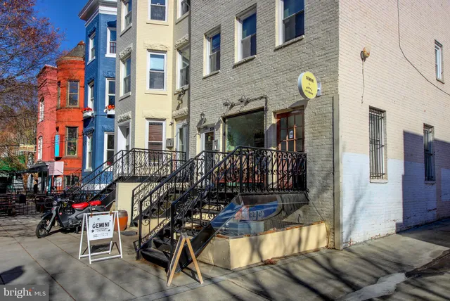 a view of street with sitting area