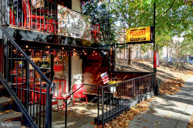 a view of a cafe with sitting area