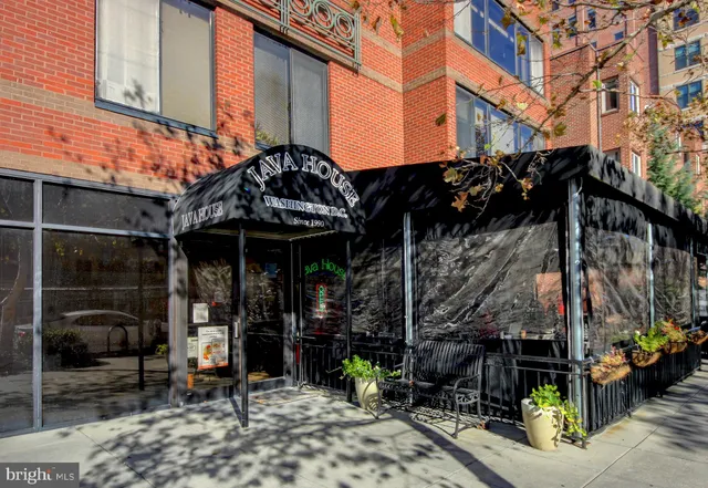 a cafe on the corner of the building