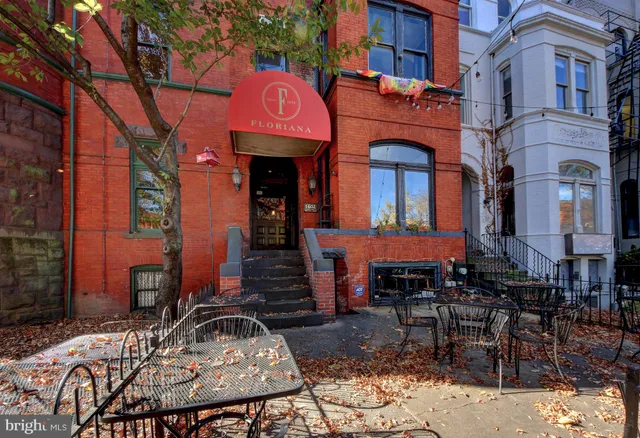a view of a building with sitting area