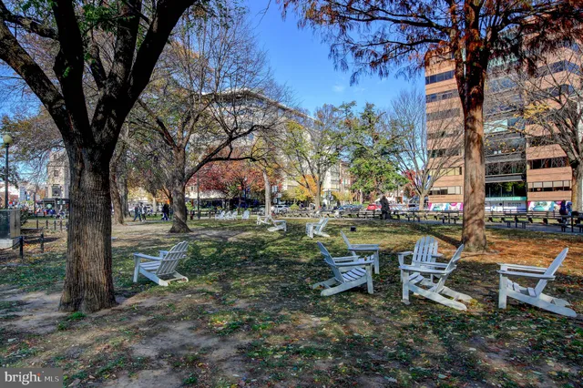 an outdoor space with lots of swings and slides
