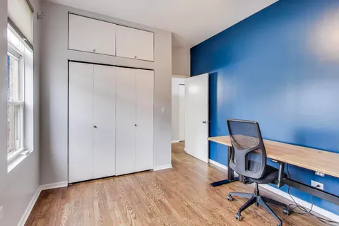 a view of workspace with wooden floor windows