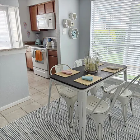 a kitchen with stainless steel appliances granite countertop a sink and a stove