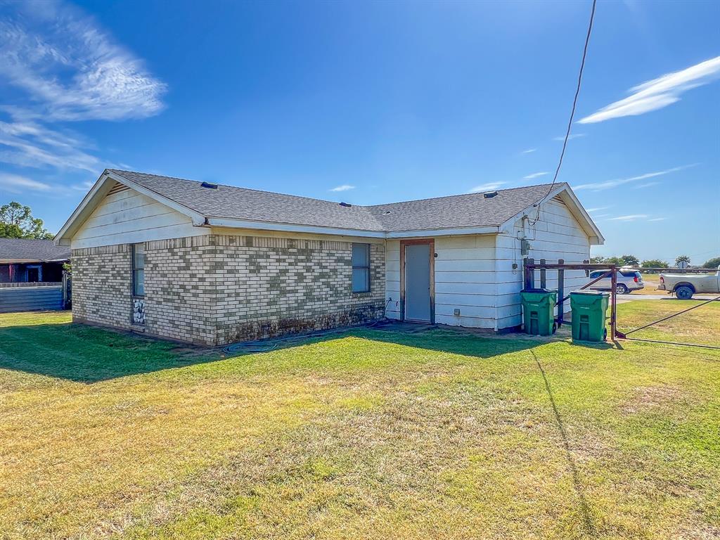 400 South Popular Street Archer City, TX 76351 - Photo 5 of 20 a view of a house with a yard and sitting area