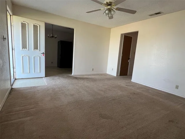 a view of a livingroom with a ceiling fan